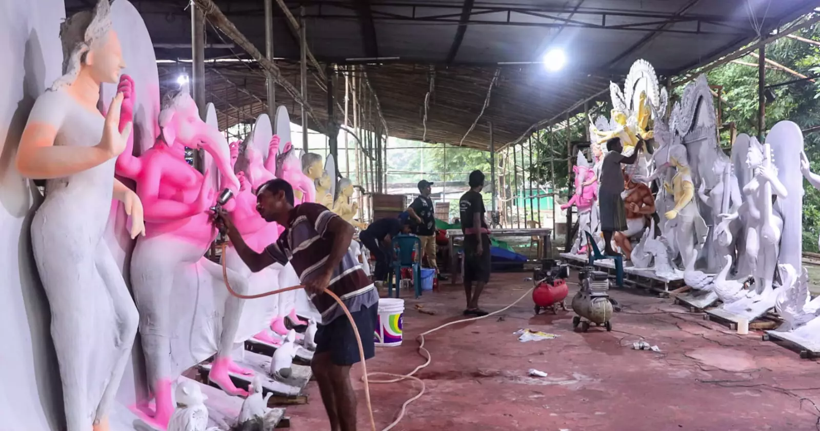 Artisans give finishing touch to idols ahead of Durga Puja