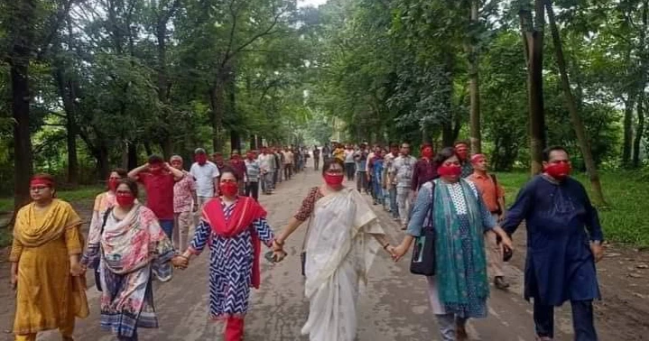 JU teachers, students hold silent march with mouths, eyes covered with red cloth