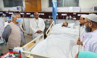 Dr Yunus visits victims of mass uprising at neurosciences hospital