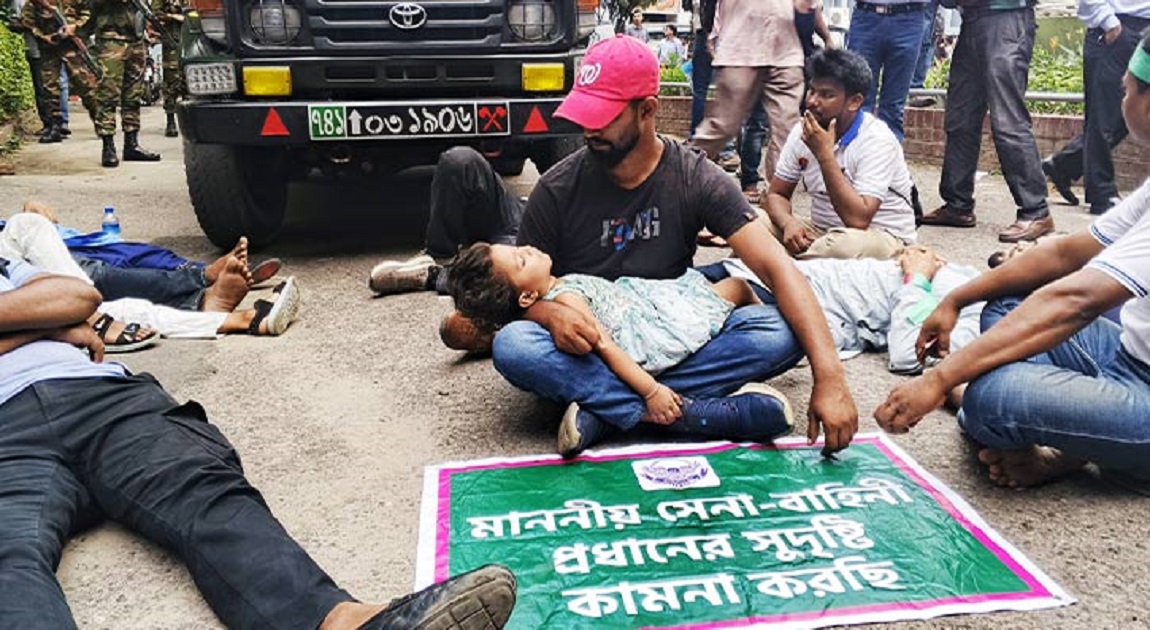 Agitating soldiers block army vehicles using child as shield