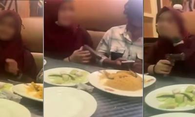 Video of young couple showing off pistol at a restaurant goes viral