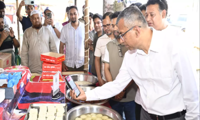 Bangladesh Bank governor promotes Bangla QR at Purbachal market
