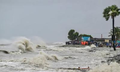 Deep depression makes landfall, storm surge threatens 14 coastal districts