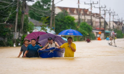 Thailand floods kill 13, leaving people stranded and roads submerged