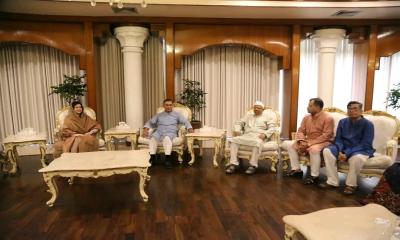 PM exchanges Eid greetings with diplomats, people at Jamuna