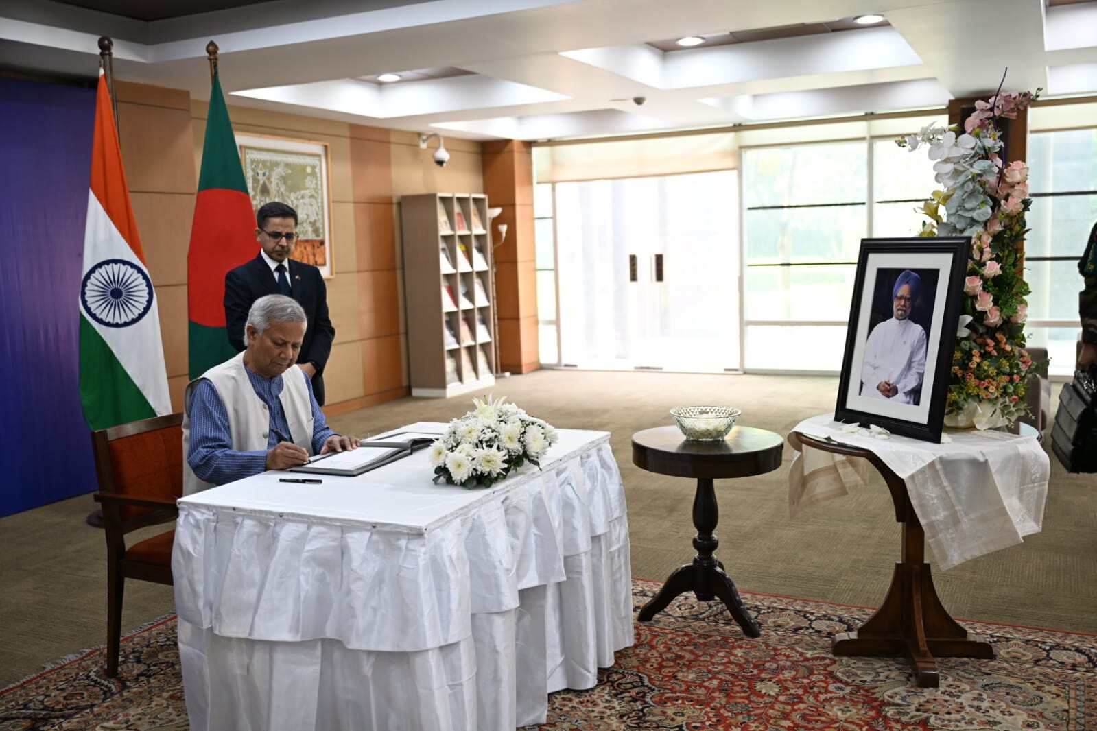 Dr. Yunus honors Manmohan Singh’s legacy at Indian High Commission in Dhaka