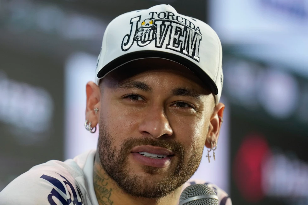 Neymar has minor left knee surgery and hopes to reach the World Cup