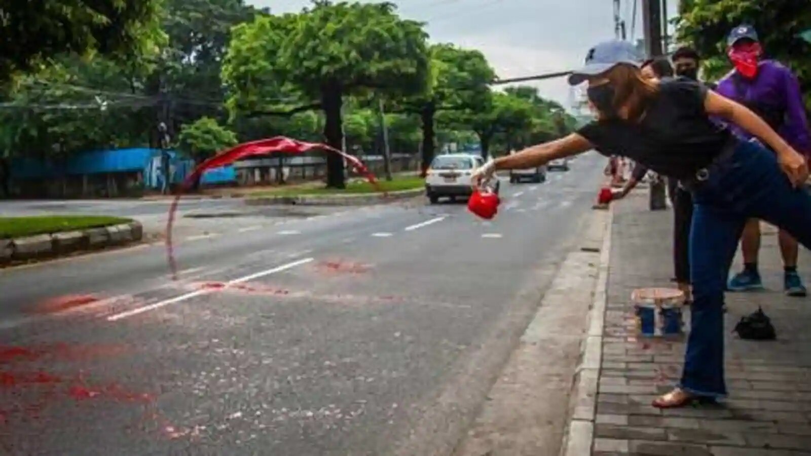 Myanmar protesters paint Yangon red, defying bloody army crackdown