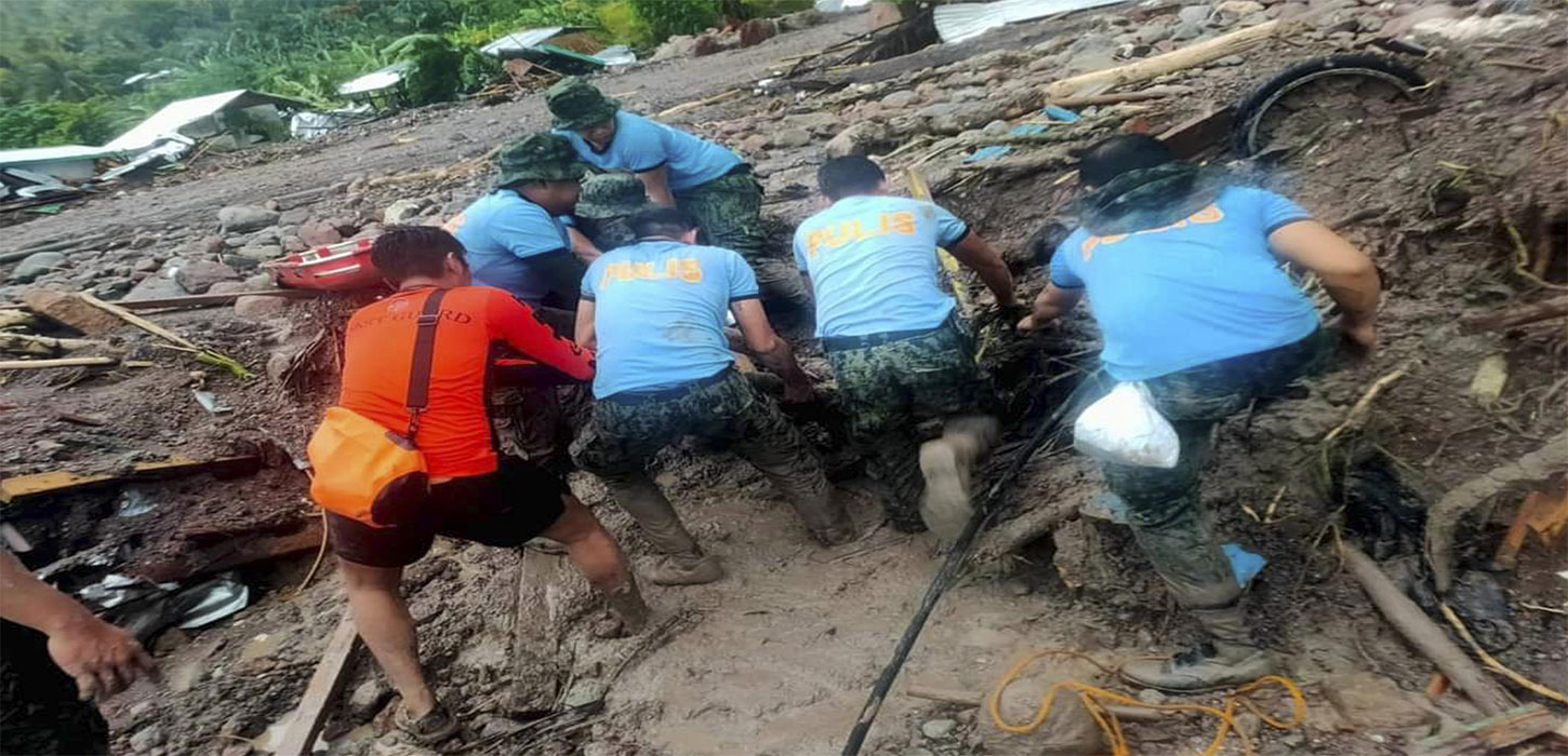 At least 72 dead, dozens feared missing as storm lashes Philippines