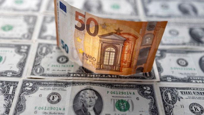 Euro drops to 20-year low, approaches parity with dollar