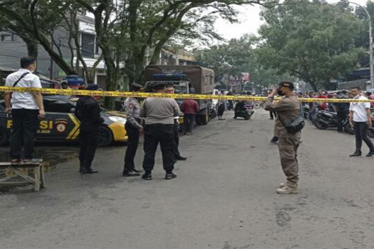 Indonesia police station kills 2 in suspected suicide attack