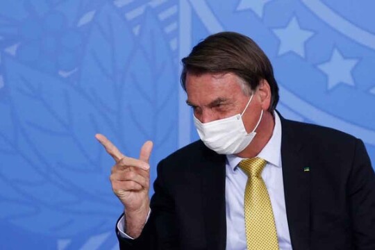 Brazil's unvaccinated president barred from soccer match