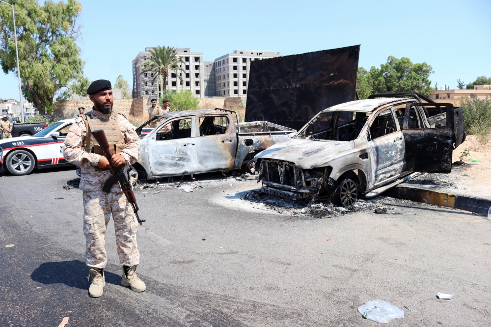 Fighting rips through Libyan capital, killing 13