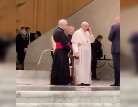 Watch: Pope breaks protocol, receives cellphone at public event